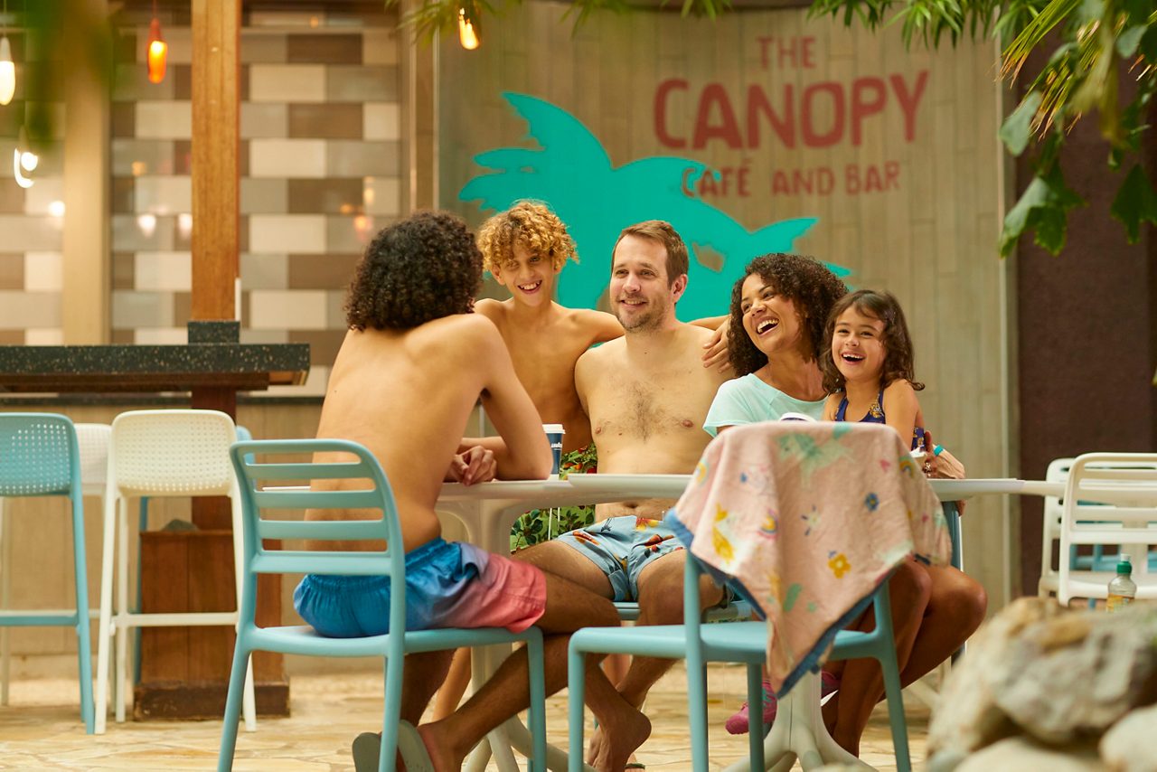 A family sat round a table at the Canopy Café and Bar.